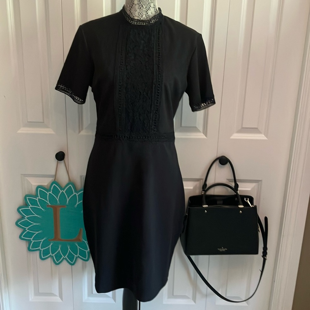 LBD with lace down front & back of dress, around high neck sleeves and waist.